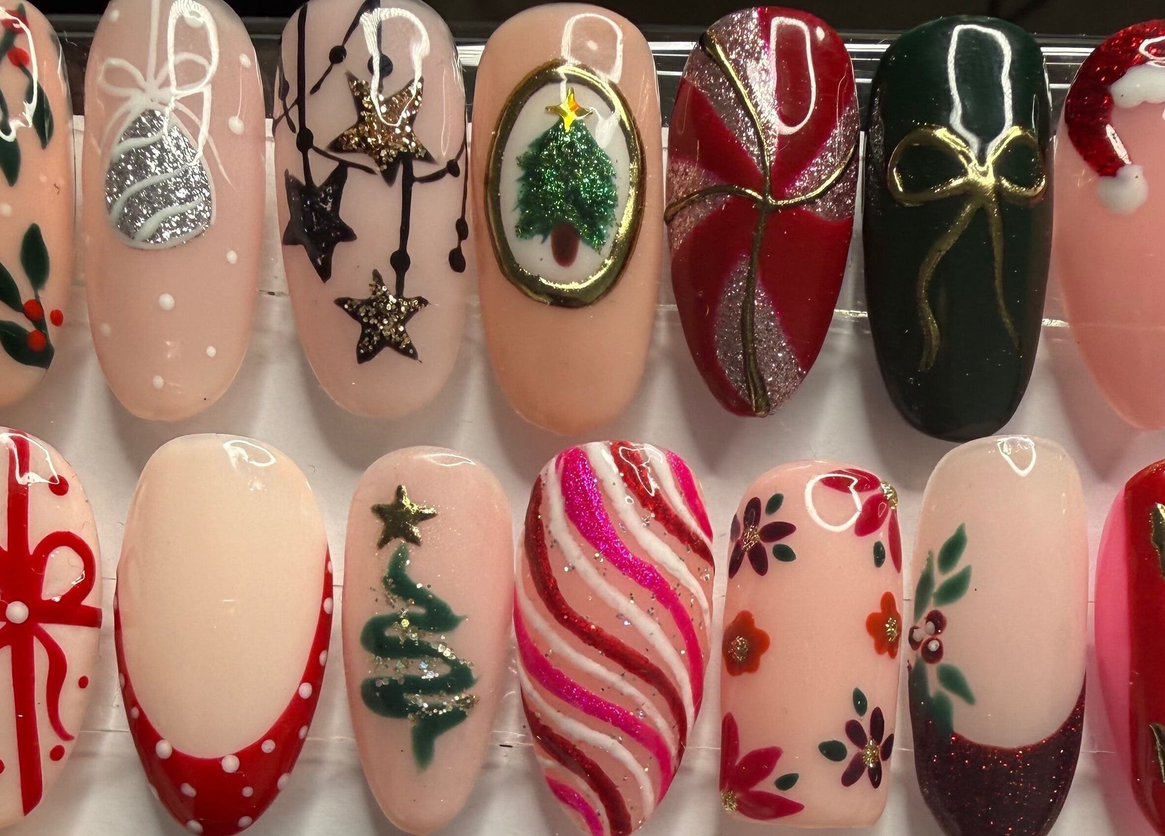 Festive Christmas-themed nail designs at Glamorous Nails & Lashes, Peterborough, England, GB.