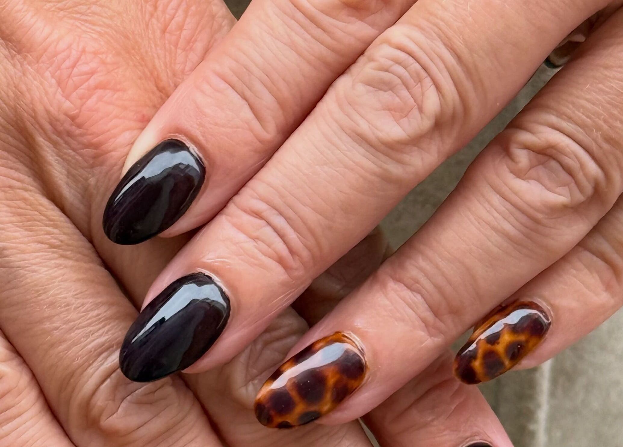 Stylish tortoise shell nails at Glamorous Nails & Lashes, Peterborough, England, GB.
