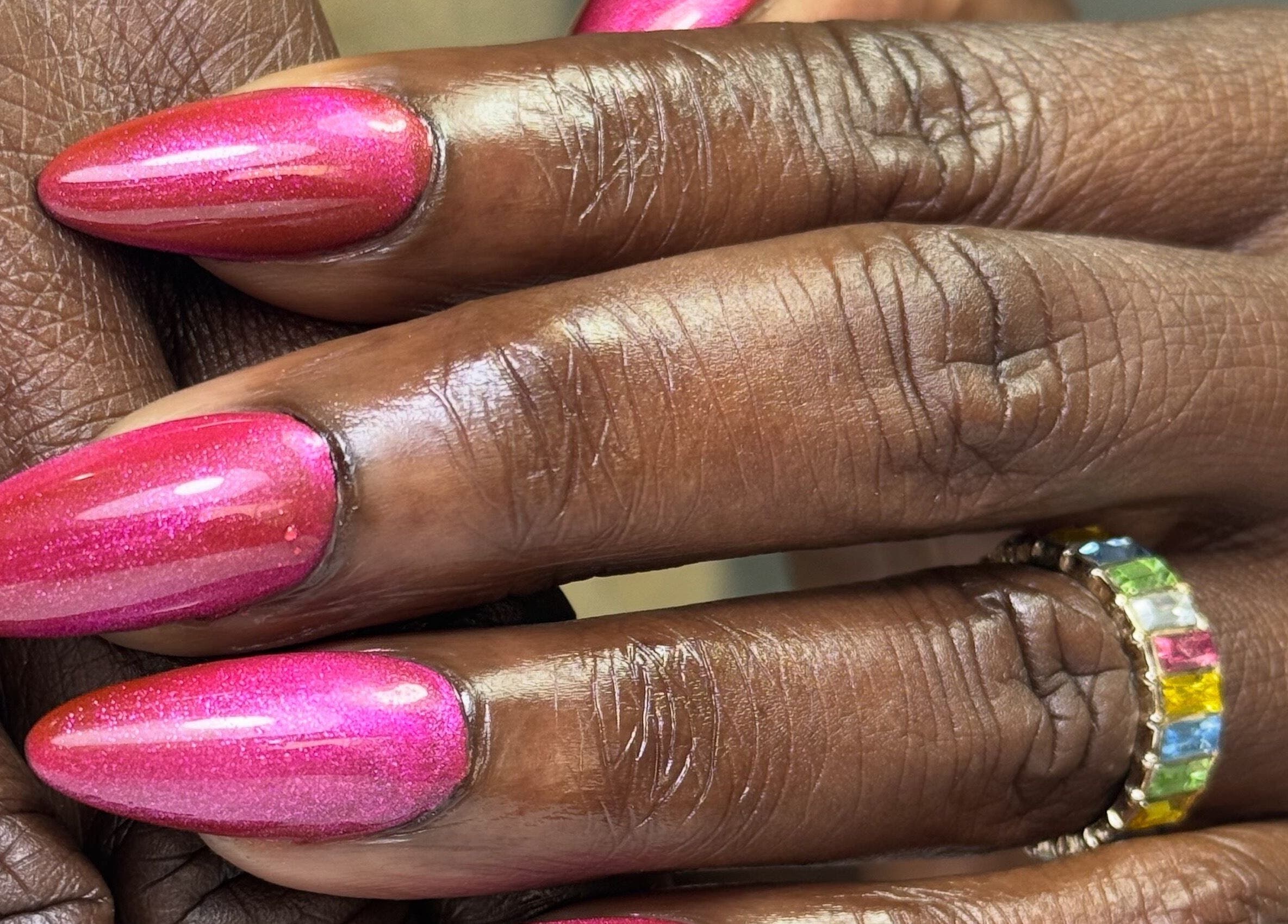 Vibrant pink nails at Glamorous Nails & Lashes, Peterborough, England, GB enhancing elegance and style.