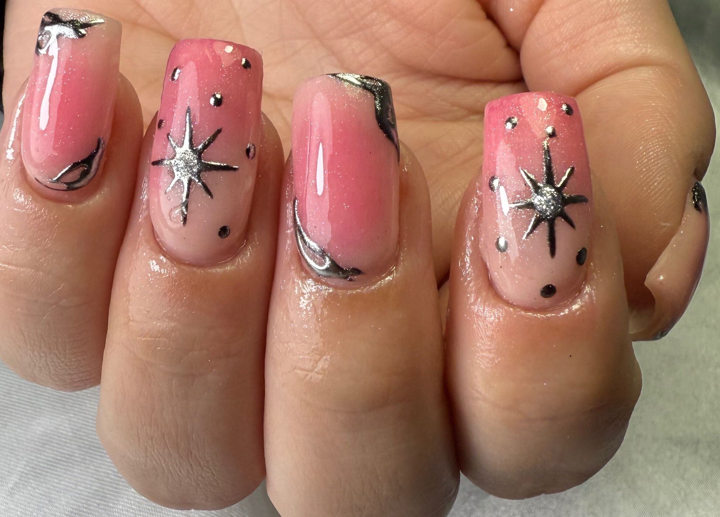 Stunning pink star-themed manicure at Glamorous Nails & Lashes, Peterborough, England, GB.