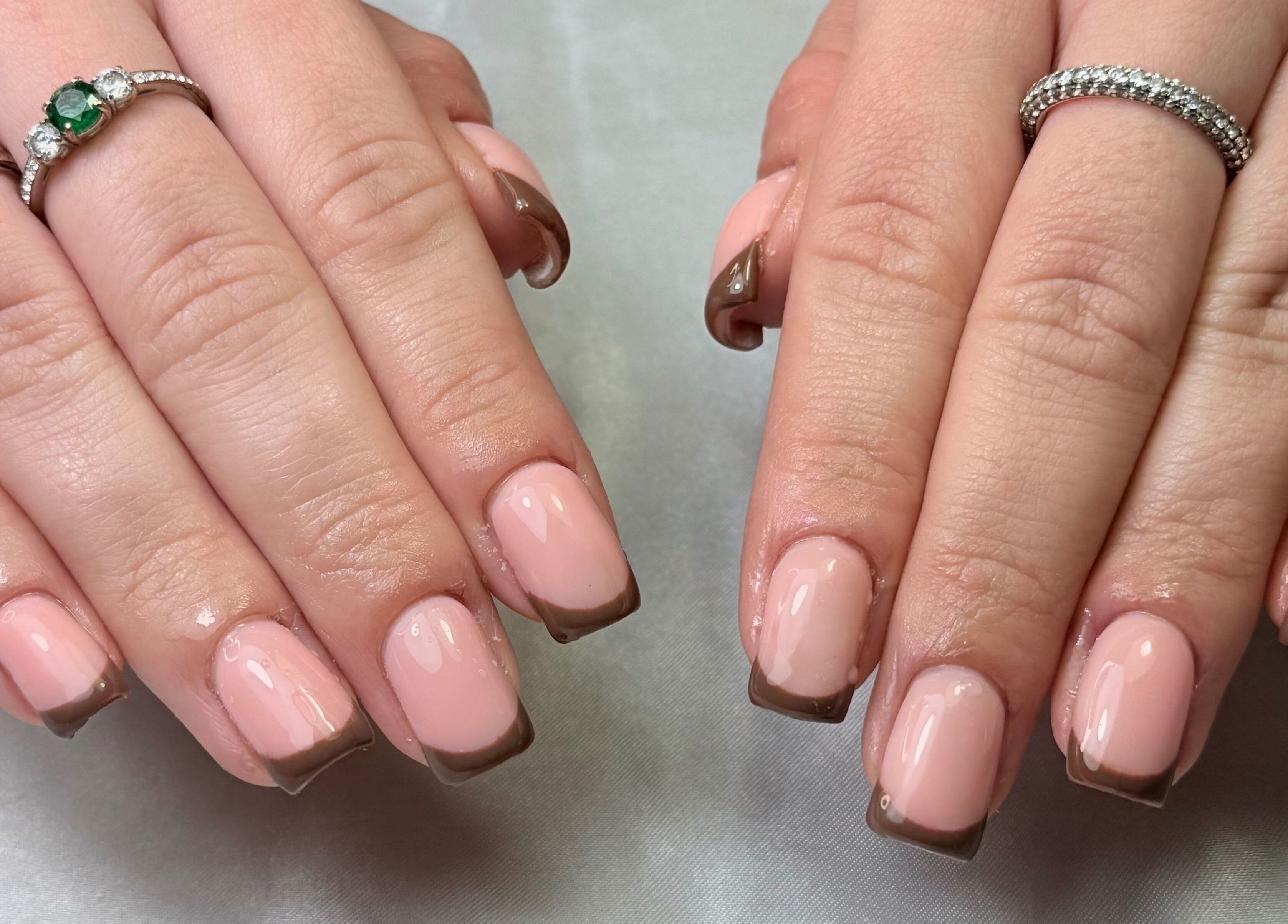 Elegant French manicure at Glamorous Nails & Lashes, Peterborough, England, GB.