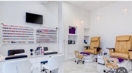 Modern interior of DK nails Roehampton, featuring plush chairs, London, England, GB.