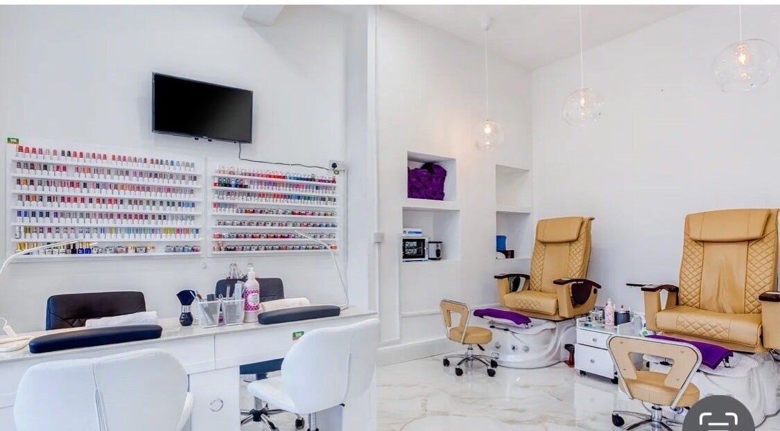 Modern interior of DK nails Roehampton, featuring plush chairs, London, England, GB.