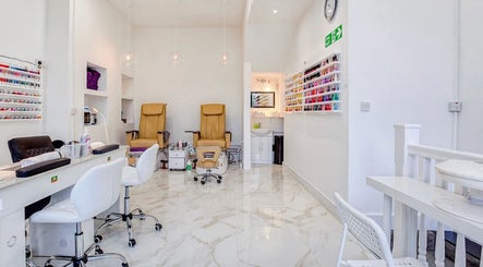 Interior of DK nails Roehampton, showcasing modern nail stations and polish shelves in London, England, GB.