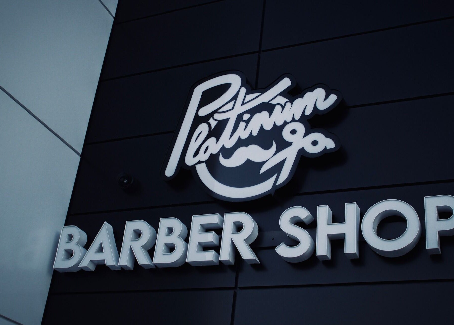 Elegant sign of Platinum Barbershop located in Edmonton, Alberta, CA.