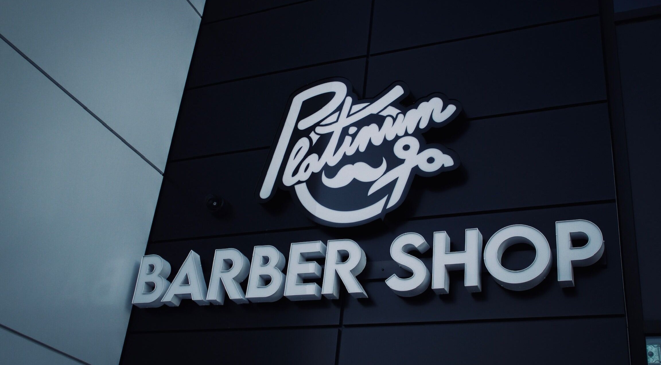 Elegant sign of Platinum Barbershop located in Edmonton, Alberta, CA.