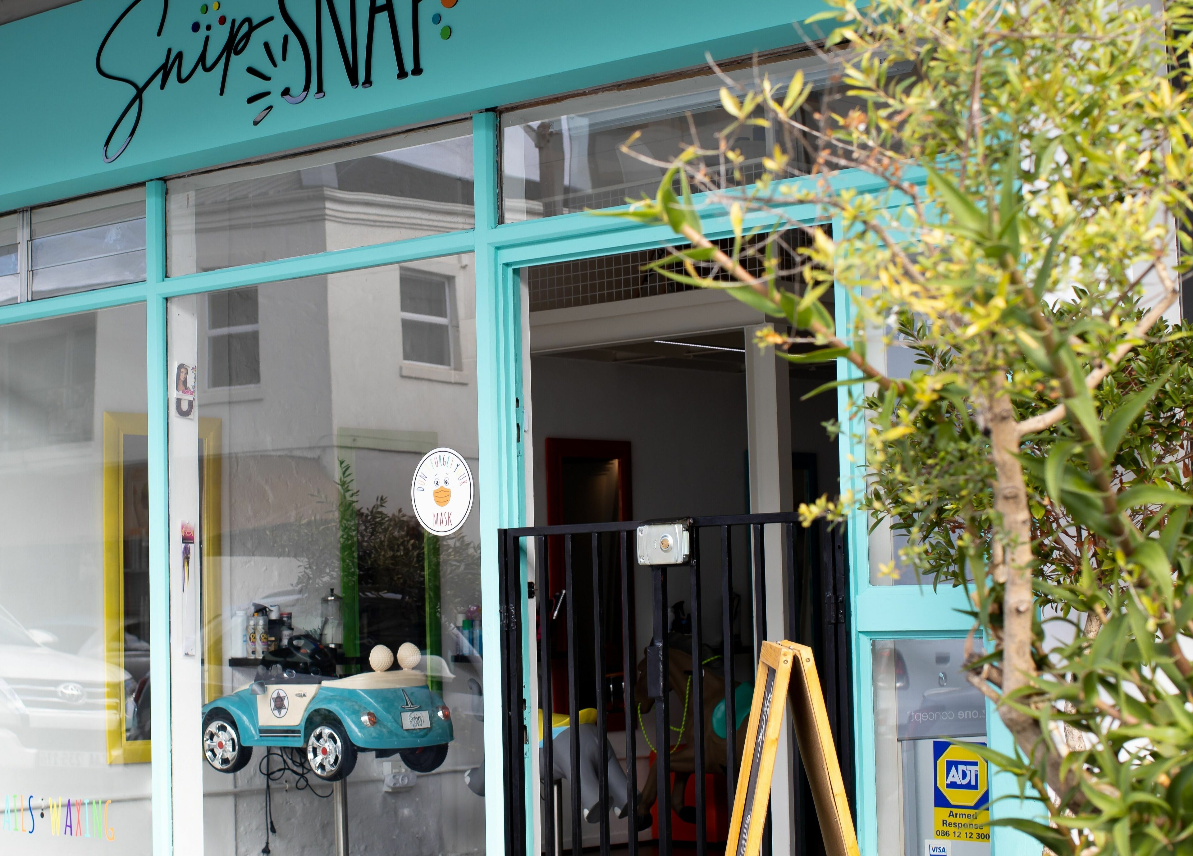 Snip Snap salon entrance in Newlands, Cape Town, Western Cape, ZA with welcoming decor.