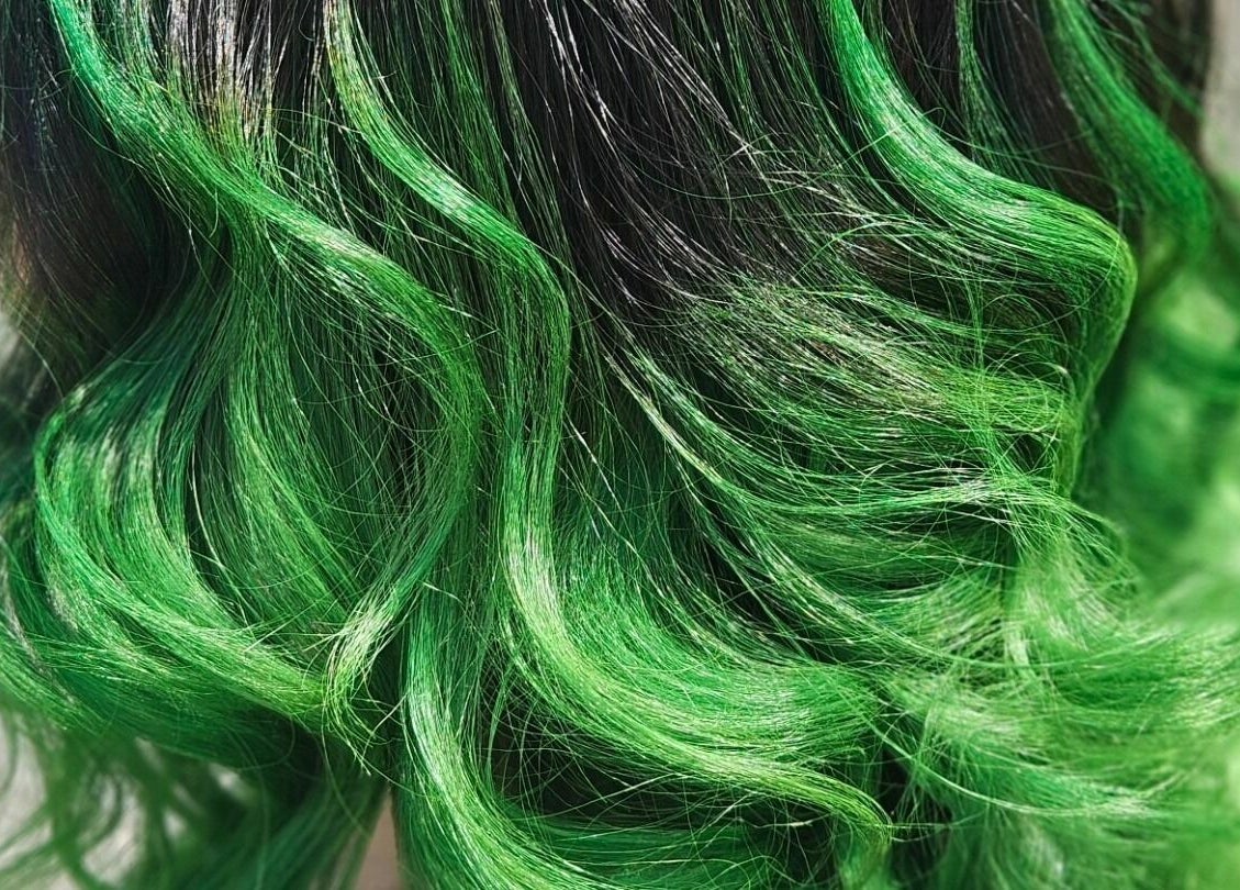 Vibrant green hair styled in waves at Snip Snap, Newlands, Cape Town, Western Cape, ZA.