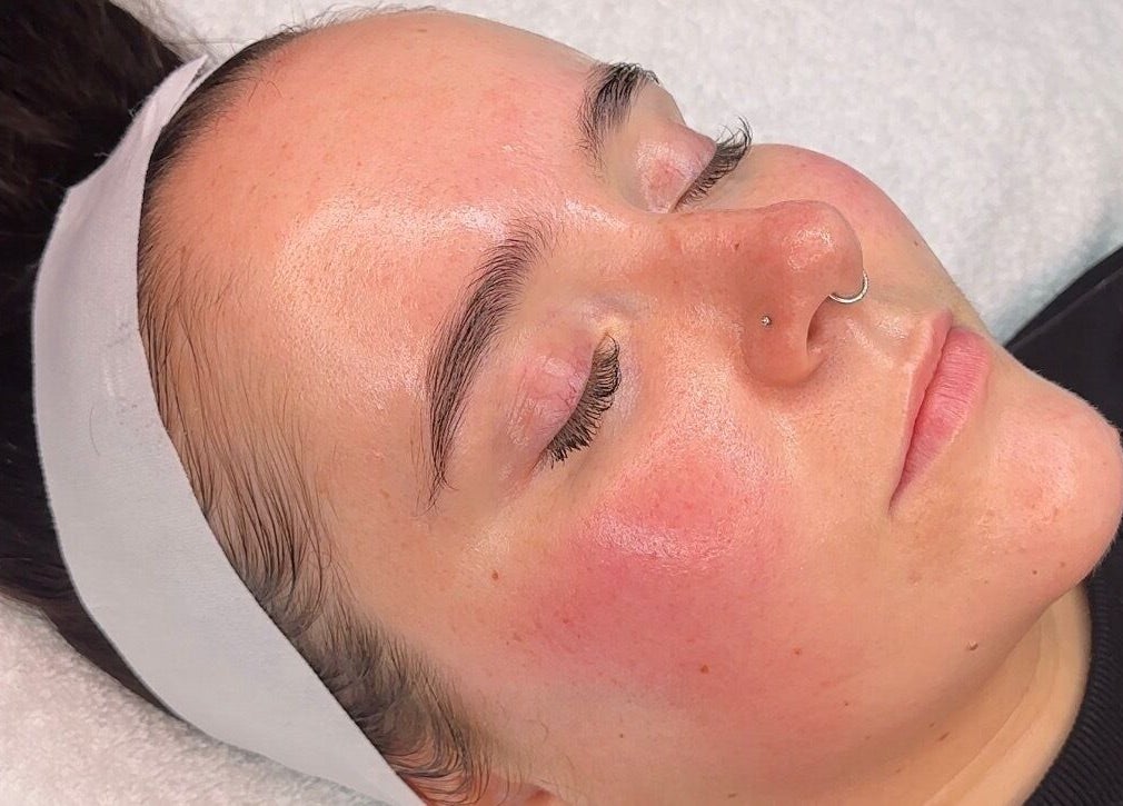 Relaxed woman enjoying a facial treatment at E.L Skin & Brows, Sheffield, England, GB.