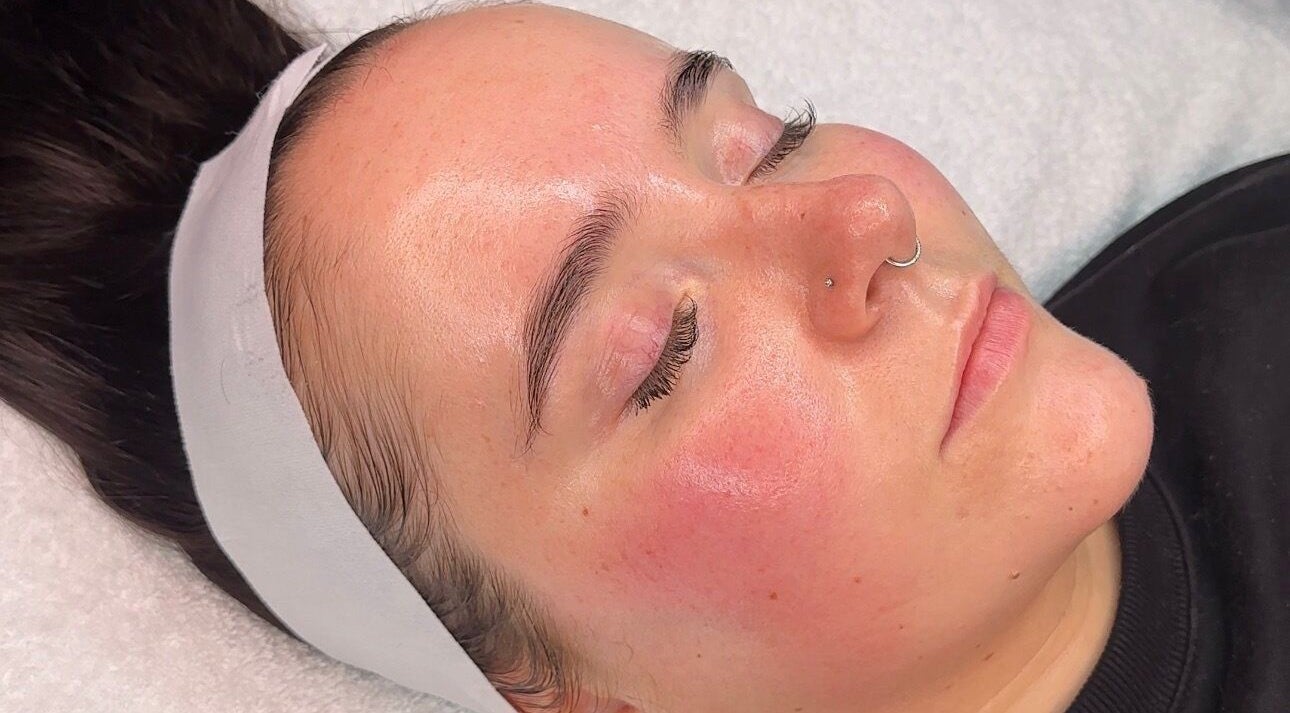 Relaxed woman enjoying a facial treatment at E.L Skin & Brows, Sheffield, England, GB.