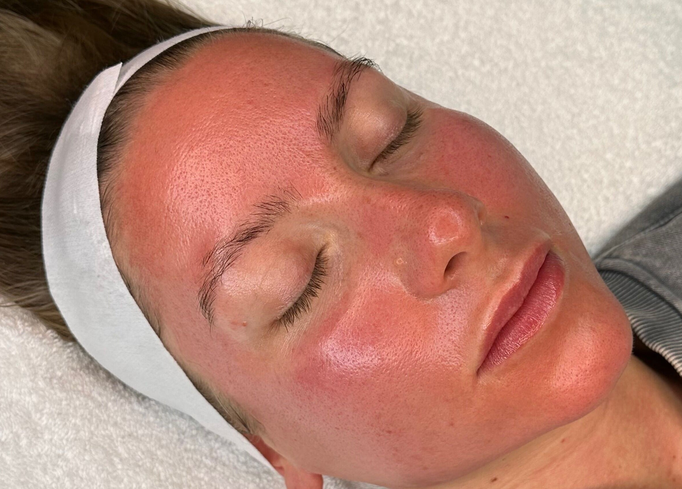 Relaxed client receiving a facial treatment at E.L Skin & Brows, Sheffield, England, GB.