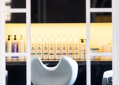 View of product display in Hideaway Hair Salon, Park Gate, England, GB, showcasing premium hair care items.