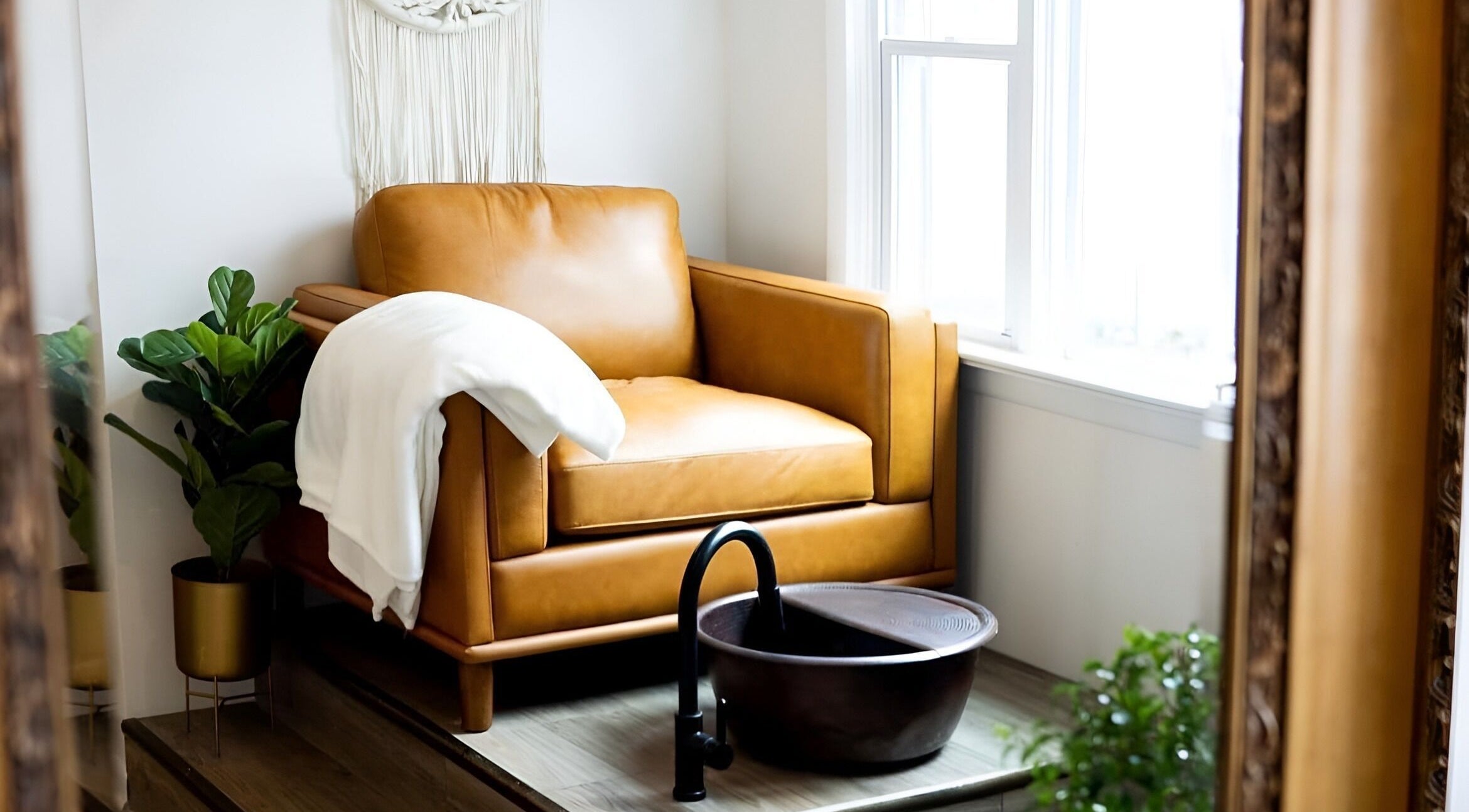 Luxurious leather chair and foot basin at The Glow House, Forty Fort, Pennsylvania, US spa retreat.