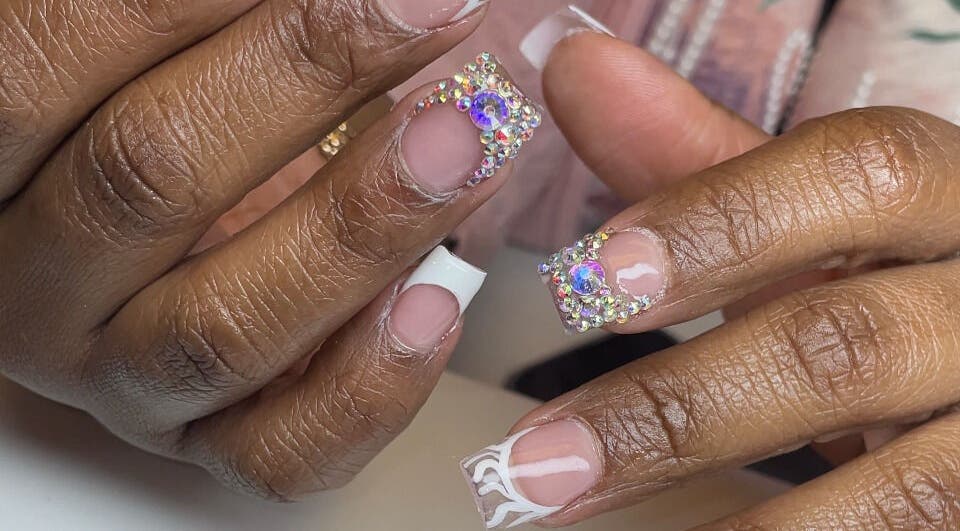 Intricate nail art with gems by Christals Acrylix at Pretty High Maintenance Day Spa, Simpsonville, South Carolina, US.