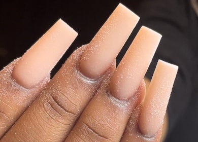 Close-up of elegant nude acrylic nails by Christals Acrylix at Pretty High Maintenance Day Spa, Simpsonville, South Carolina, US.