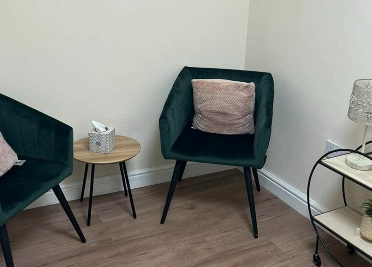 A cozy seating area at GH Hair Design, King's Lynn, England, GB, featuring plush chairs and elegant decor.