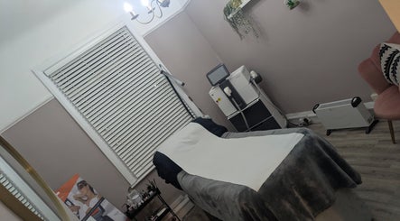 Relaxing treatment room at Kerry Osborne Make Up & Beauty, Ellesmere Port, England, GB, featuring a comfortable massage table.