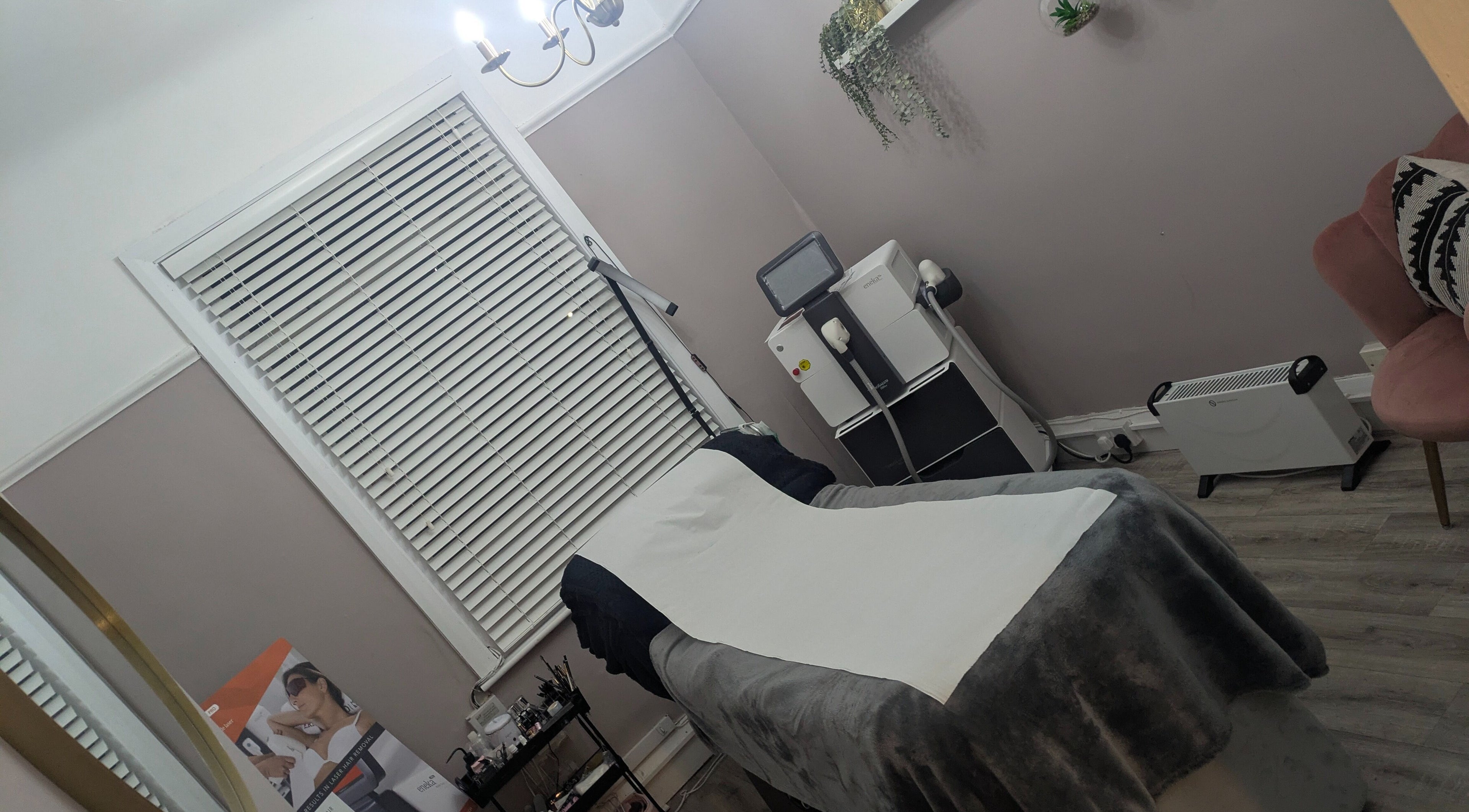 Relaxing treatment room at Kerry Osborne Make Up & Beauty, Ellesmere Port, England, GB, featuring a comfortable massage table.