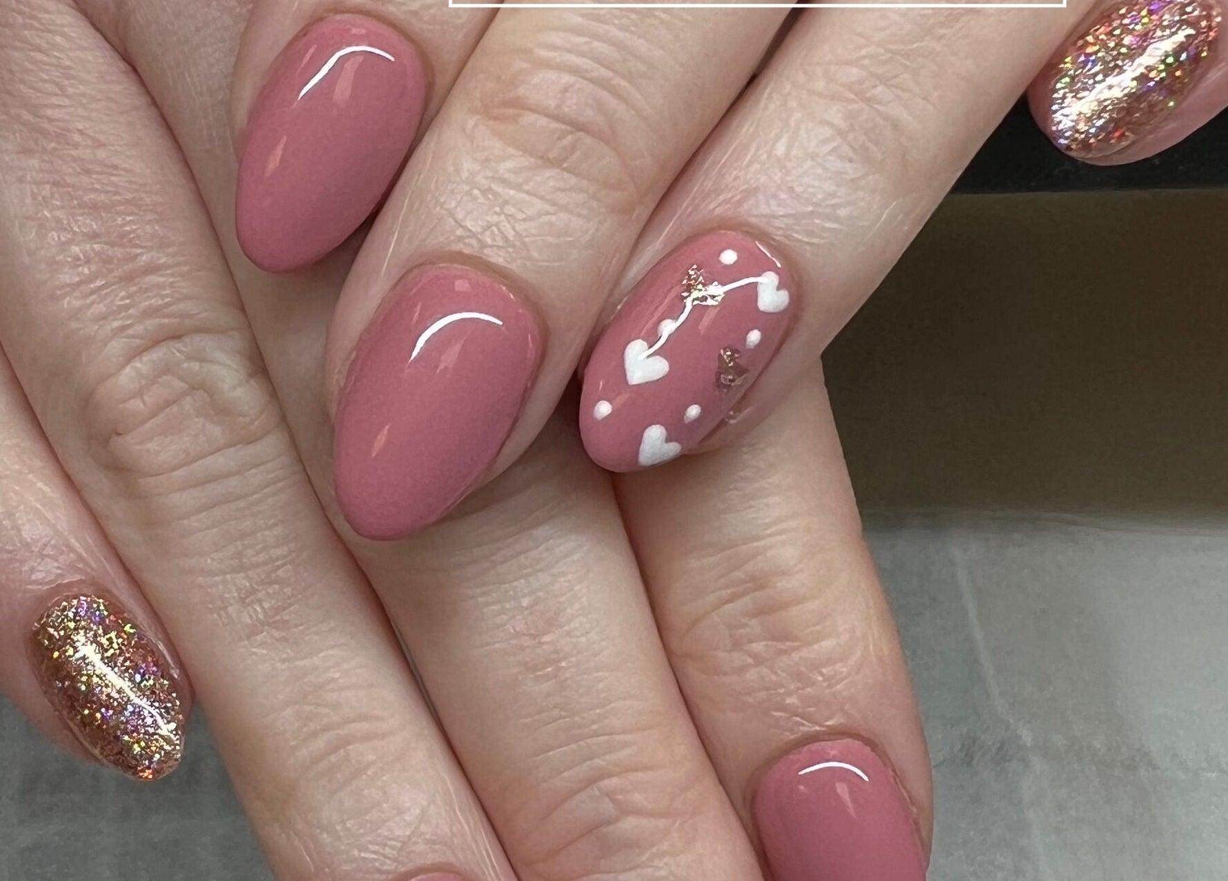 Elegant nail art at Nails by Amy McDonald in Kirkcaldy, Scotland, GB, featuring blush hues and glitter accents.