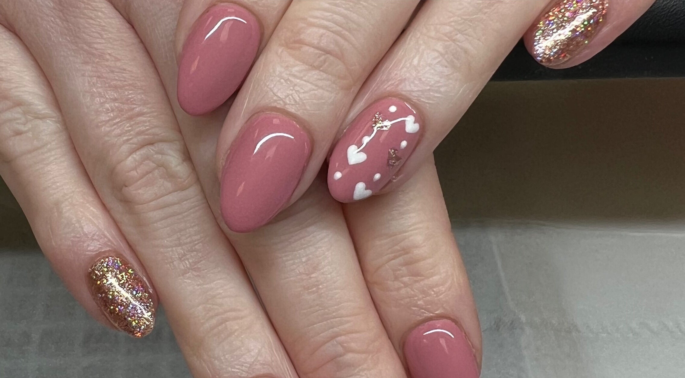 Elegant nail art at Nails by Amy McDonald in Kirkcaldy, Scotland, GB, featuring blush hues and glitter accents.