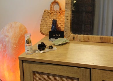 Tranquil spa setting at Āio Massage And Beauty Therapy in Maraetai, Auckland, NZ, featuring a glowing salt lamp.