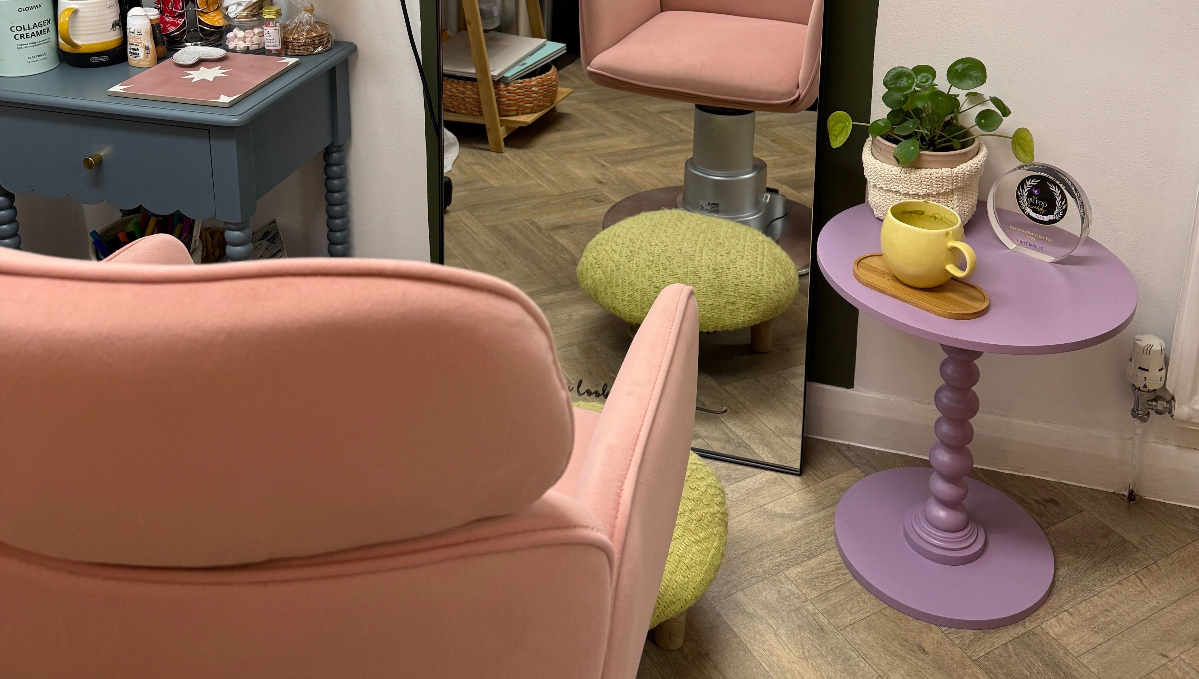Cozy pink chair and table setup at The Craft Hairdresser in Botley, England, GB.