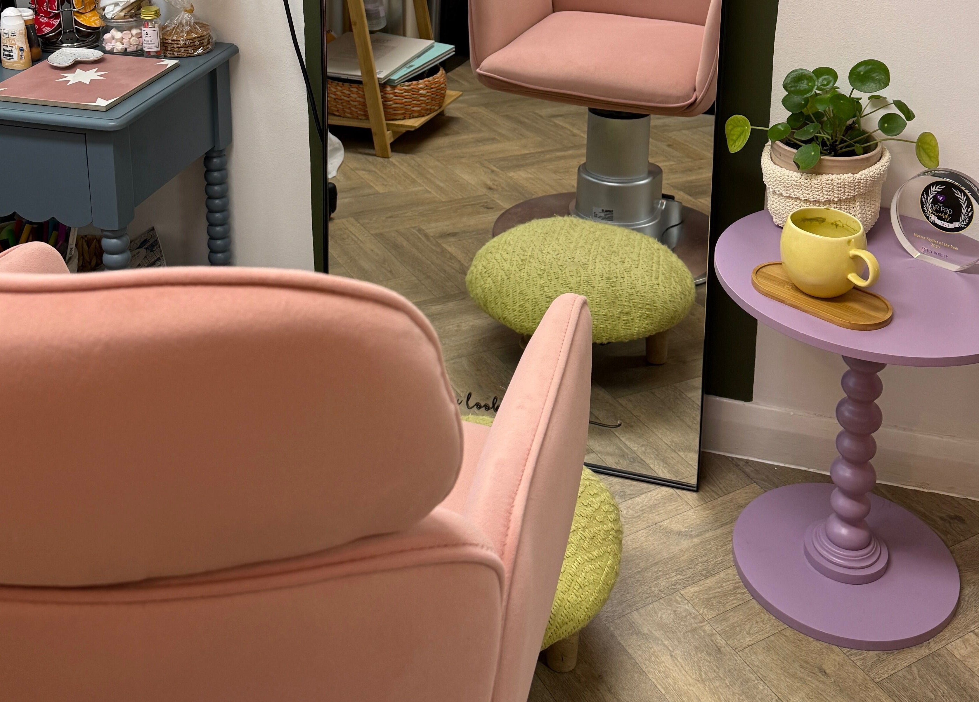 Cozy pink chair and table setup at The Craft Hairdresser in Botley, England, GB.