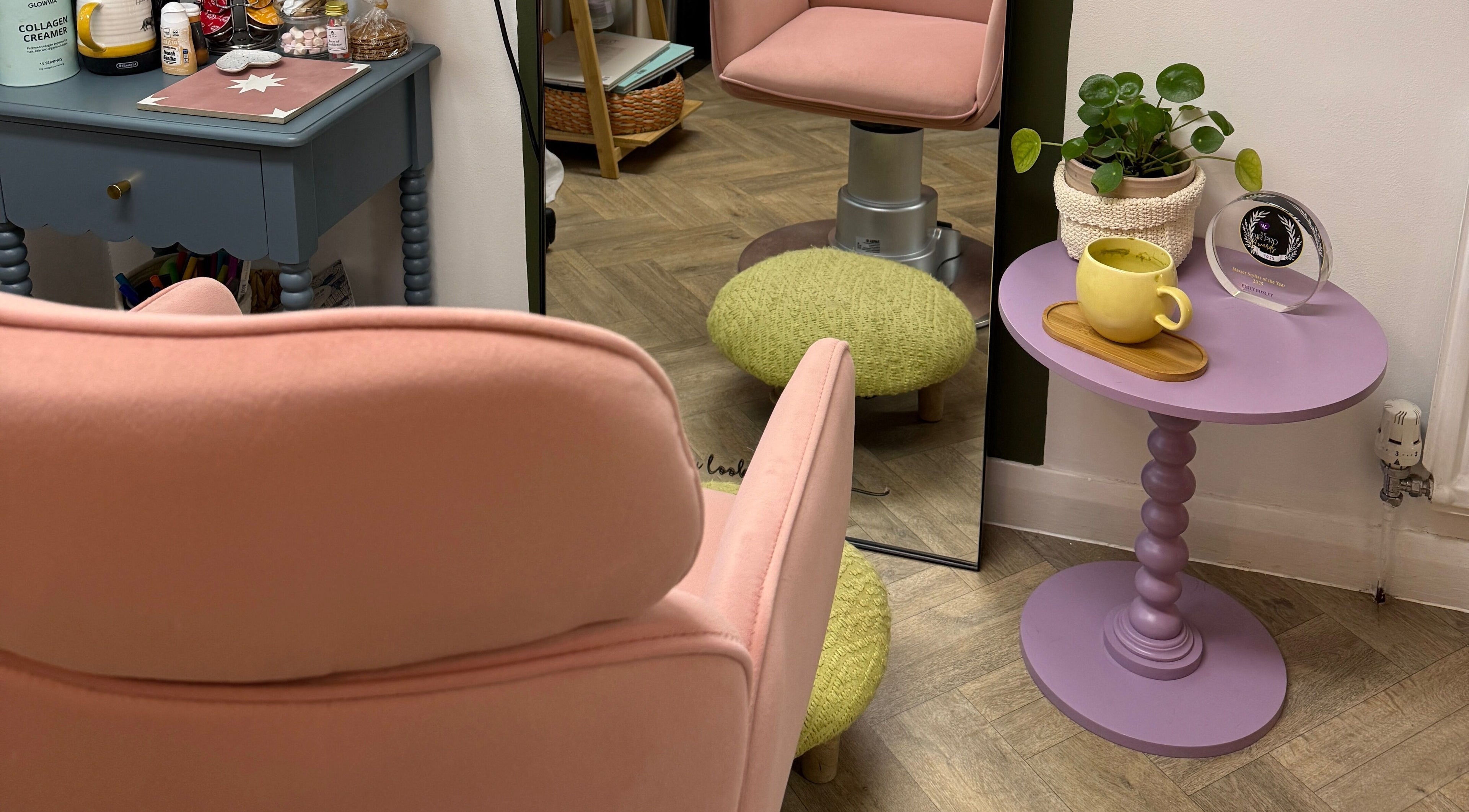 Cozy pink chair and table setup at The Craft Hairdresser in Botley, England, GB.