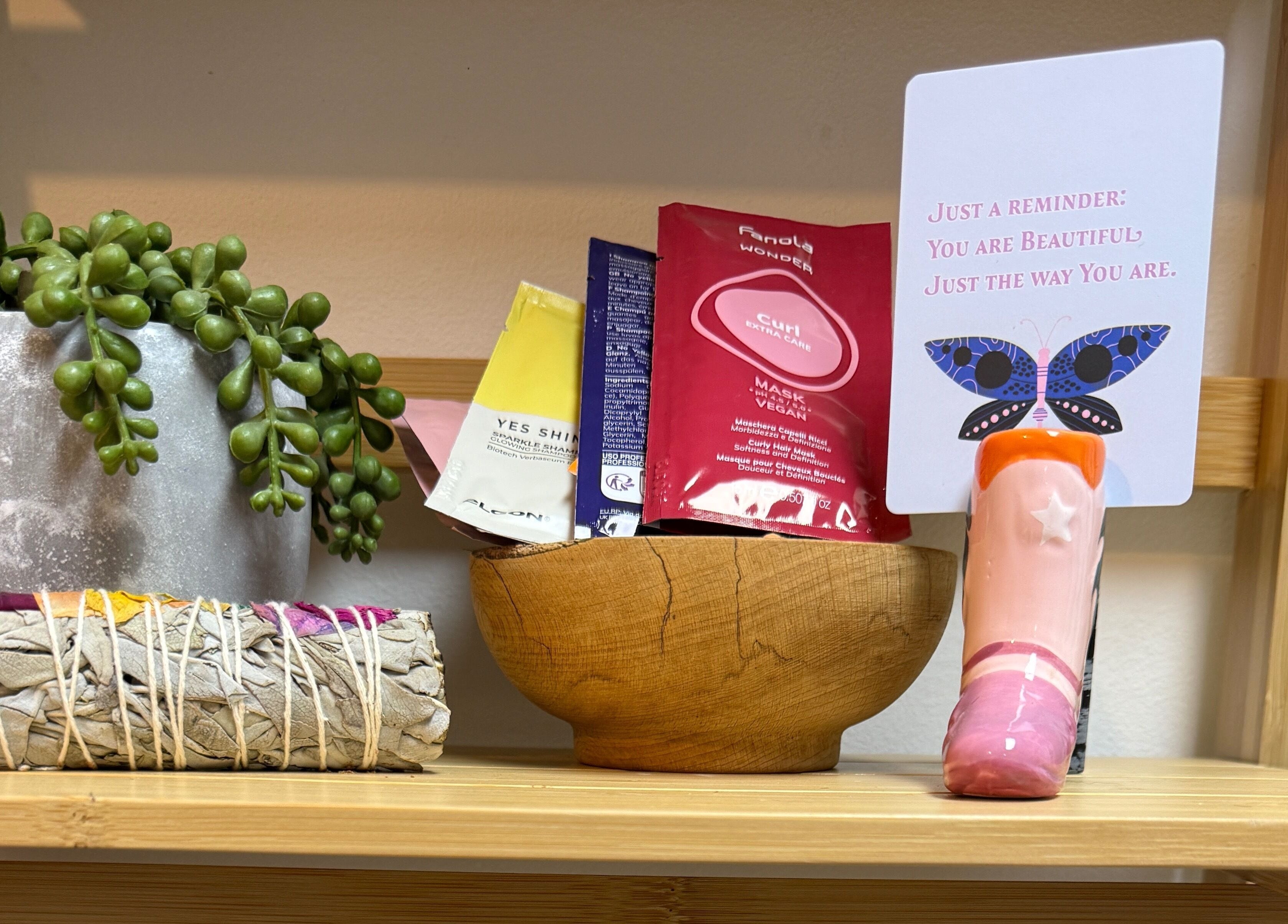 Sage smudge stick, succulent, and beauty products at The Craft Hairdresser, Botley, England, GB.