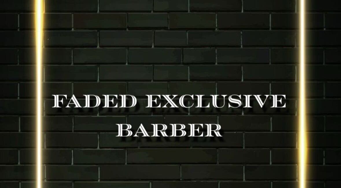 Faded (Exclusive Barber) logo on a stylish brick wall, located in Humble, Texas, US.
