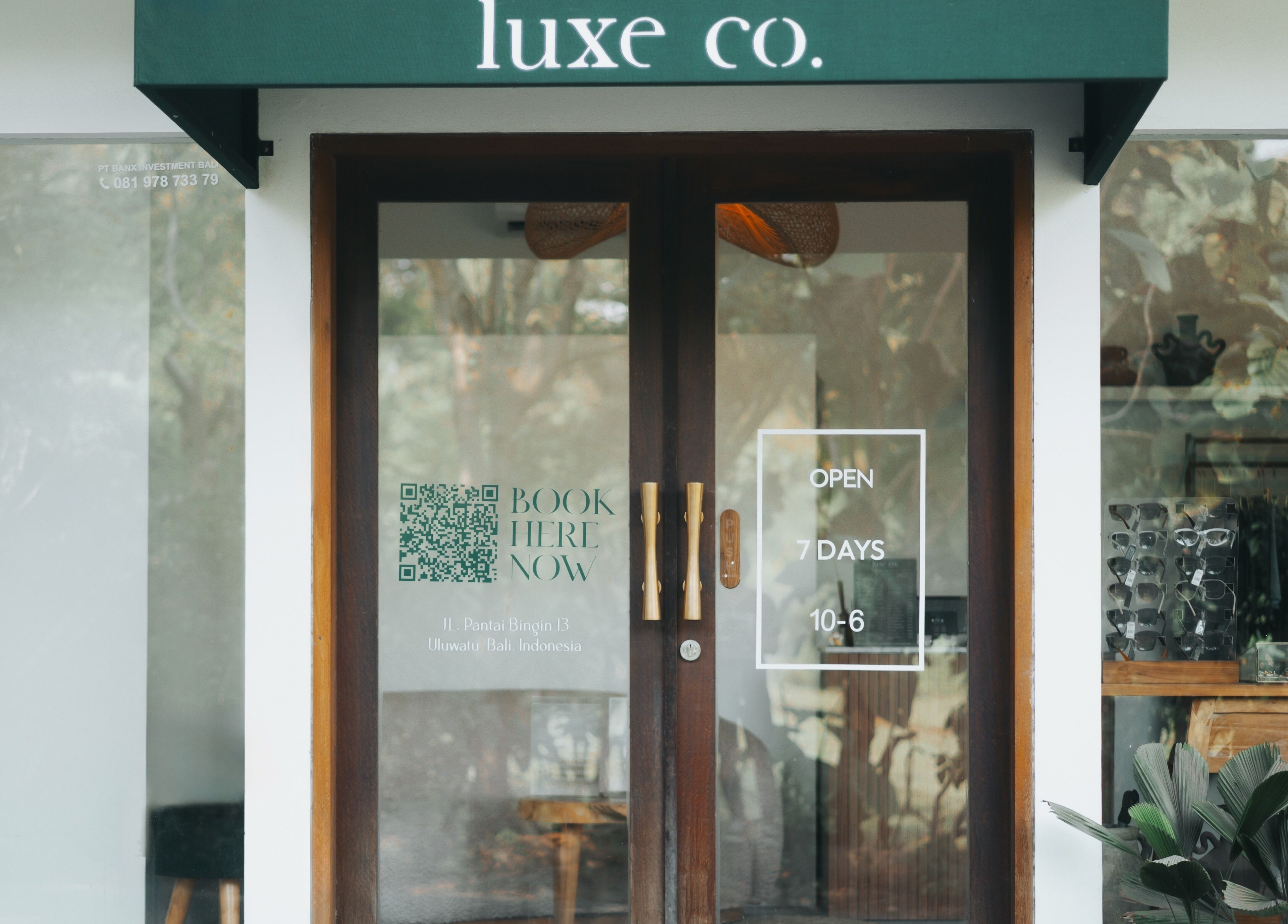 Entrance of Luxe Co. Bali, a beauty and wellness venue in Bali, Bali, ID, showcasing sleek glass doors.
