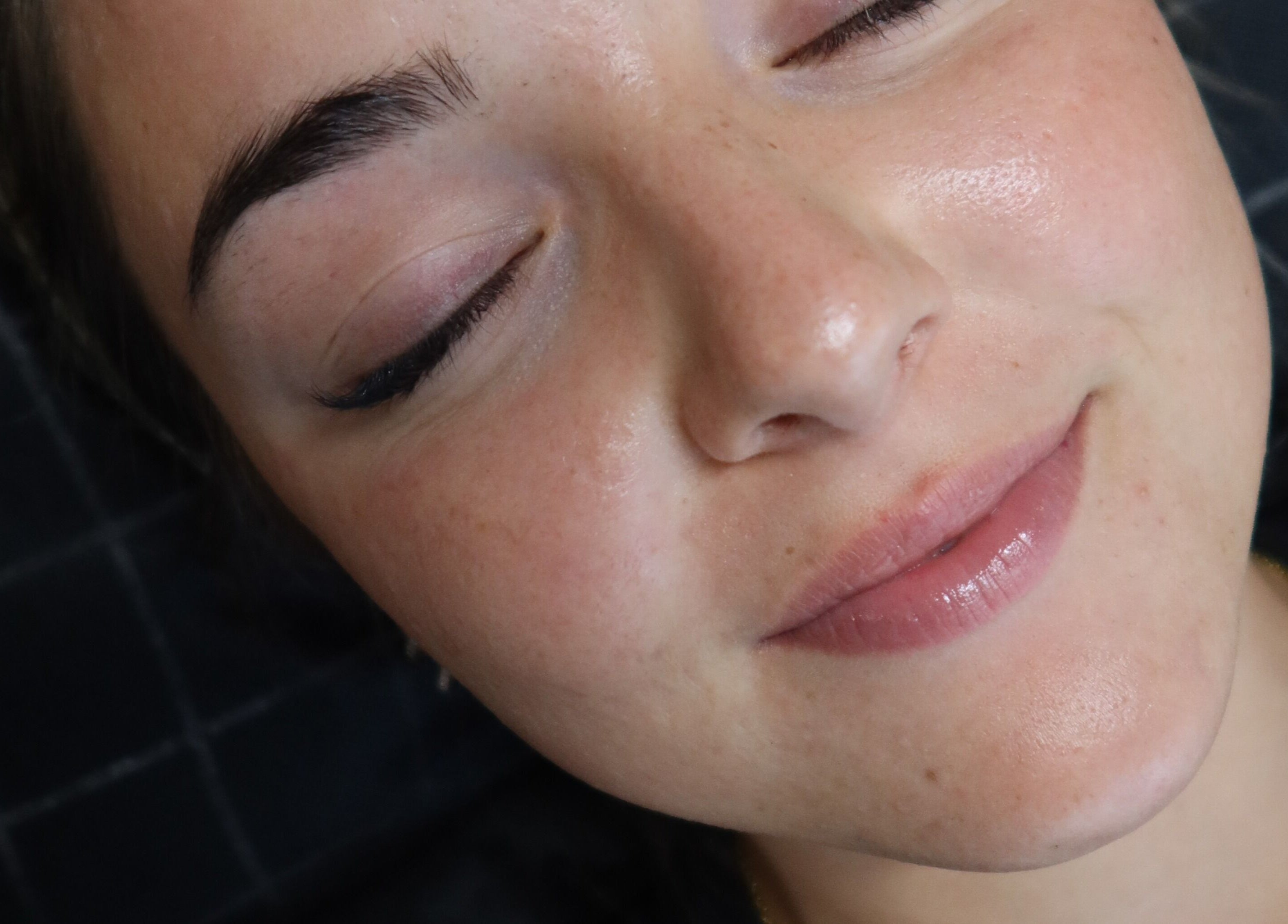 Close-up of a serene face with natural glow at Luxe Co. Bali, located in Bali, Bali, ID.