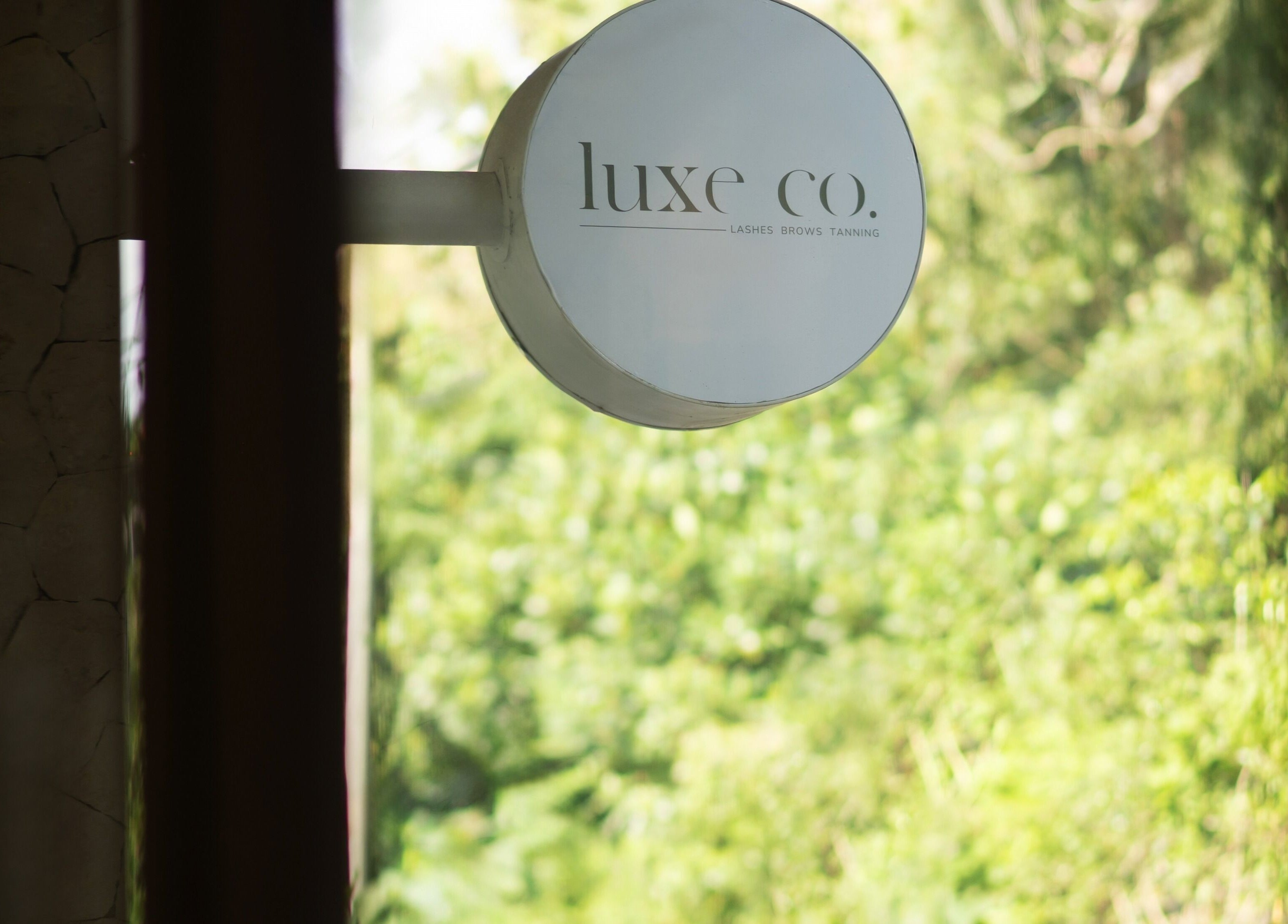 Luxe Co. Bali venue sign against lush greenery, Bali, Bali, ID.