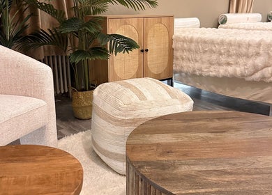 Cozy relaxation area at HELA Skincare-Midtown, New York, with plush seating and decor.
