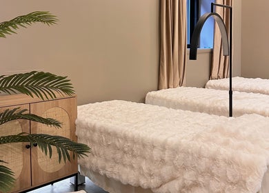 Luxurious treatment beds at HELA Skincare- Midtown, New York, New York, US, offering a peaceful ambiance.