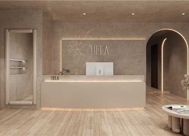 Sleek reception area of HELA Skincare- SoHo in New York, New York, US with modern decor and soft lighting.