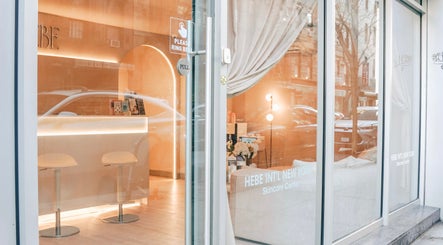 HELA Skincare- SoHo entrance reflecting New York, New York, US streetscape, inviting atmosphere.