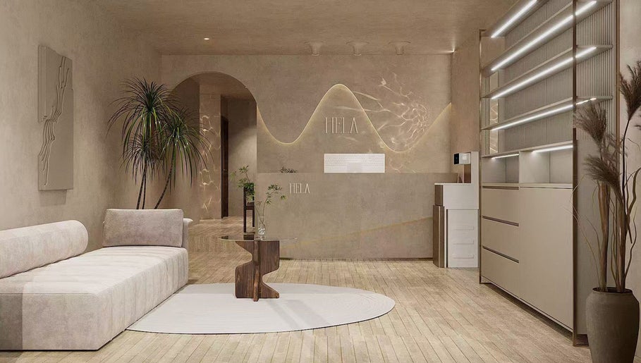 Relaxing lounge at HELA Skincare- Flushing, New York, New York, US with modern decor and comfortable seating.