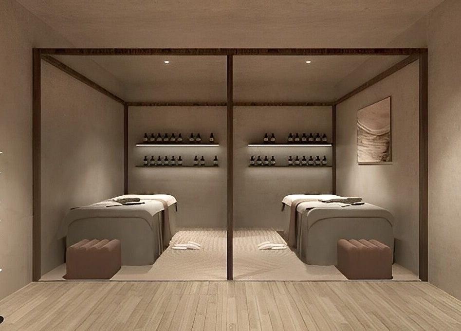 Tranquil spa room at HELA Skincare- Flushing, New York. Dual massage tables and ambient lighting evoke a relaxing atmosphere.