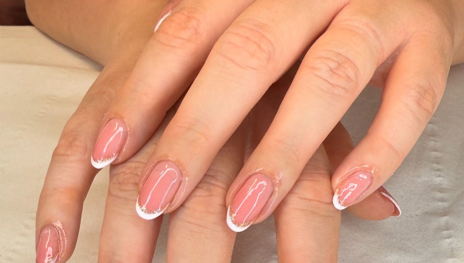 Manicured nails with pink polish at 19 Beauty Room, Leigh, England, GB.