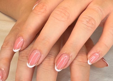 Manicured nails with pink polish at 19 Beauty Room, Leigh, England, GB.