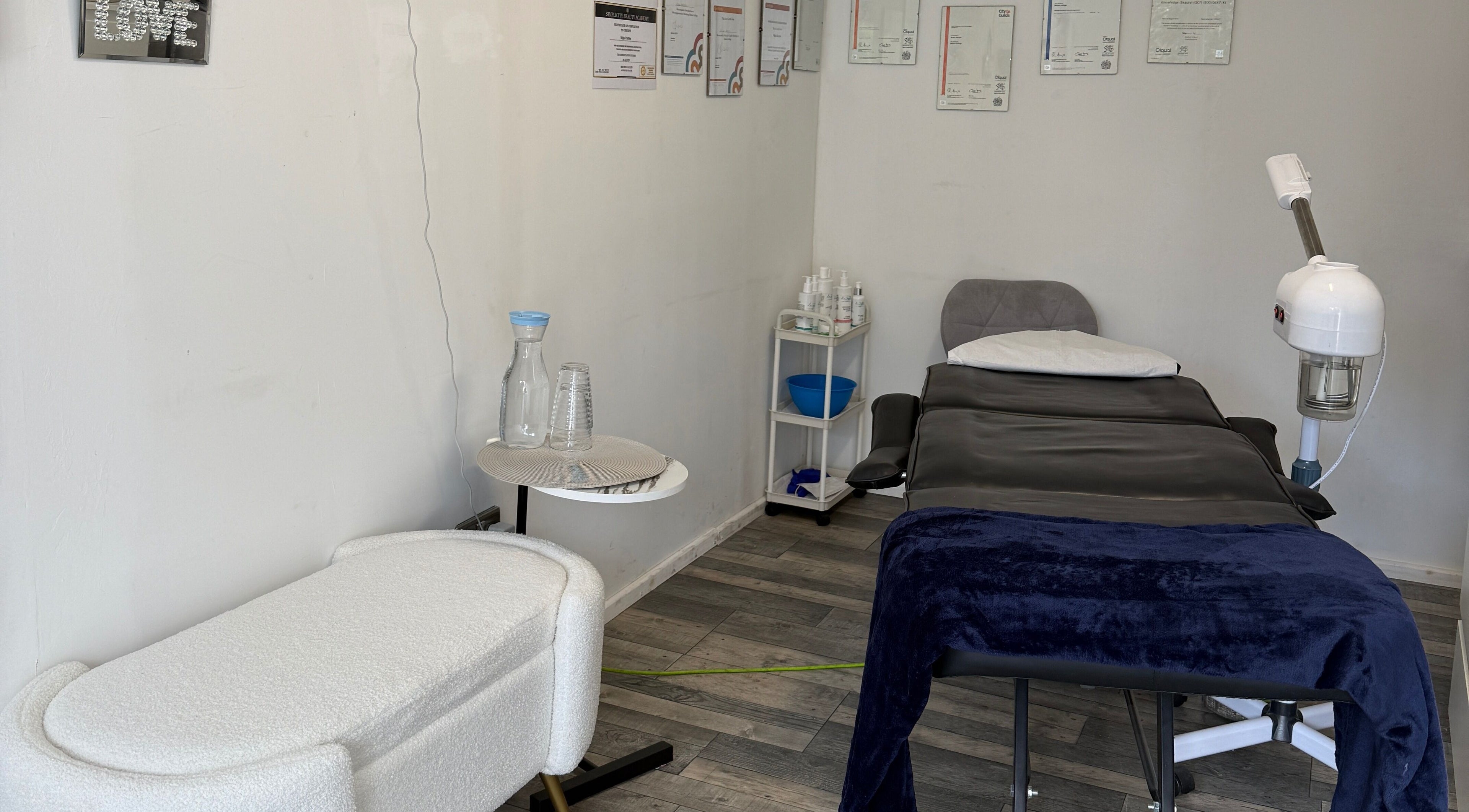 Tranquil spa room at 19 Beauty Room in Leigh, England, GB, featuring a massage table and clean, relaxing décor.