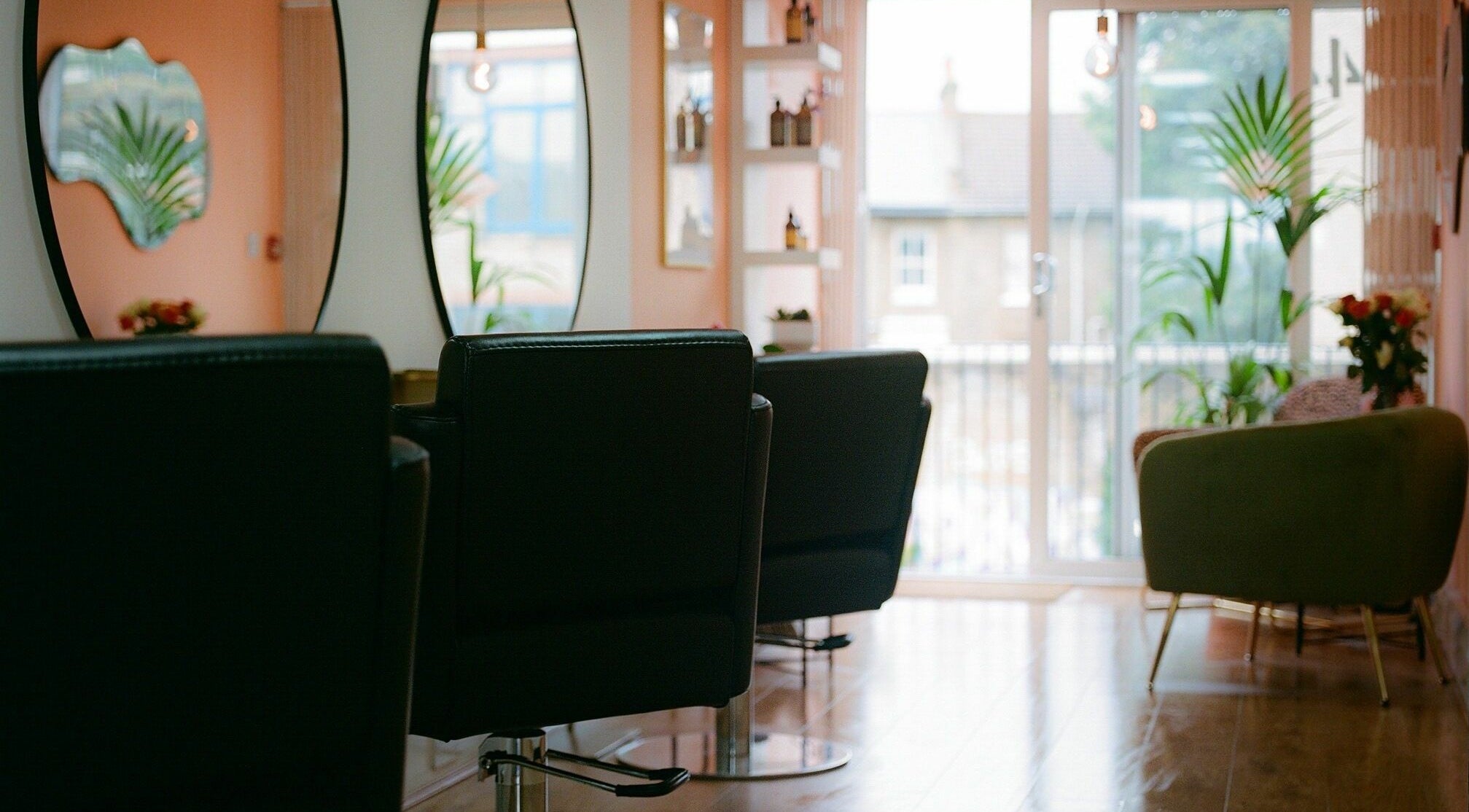 Spacious salon with modern chairs and mirrors at Barnet Fair, London, England, GB.