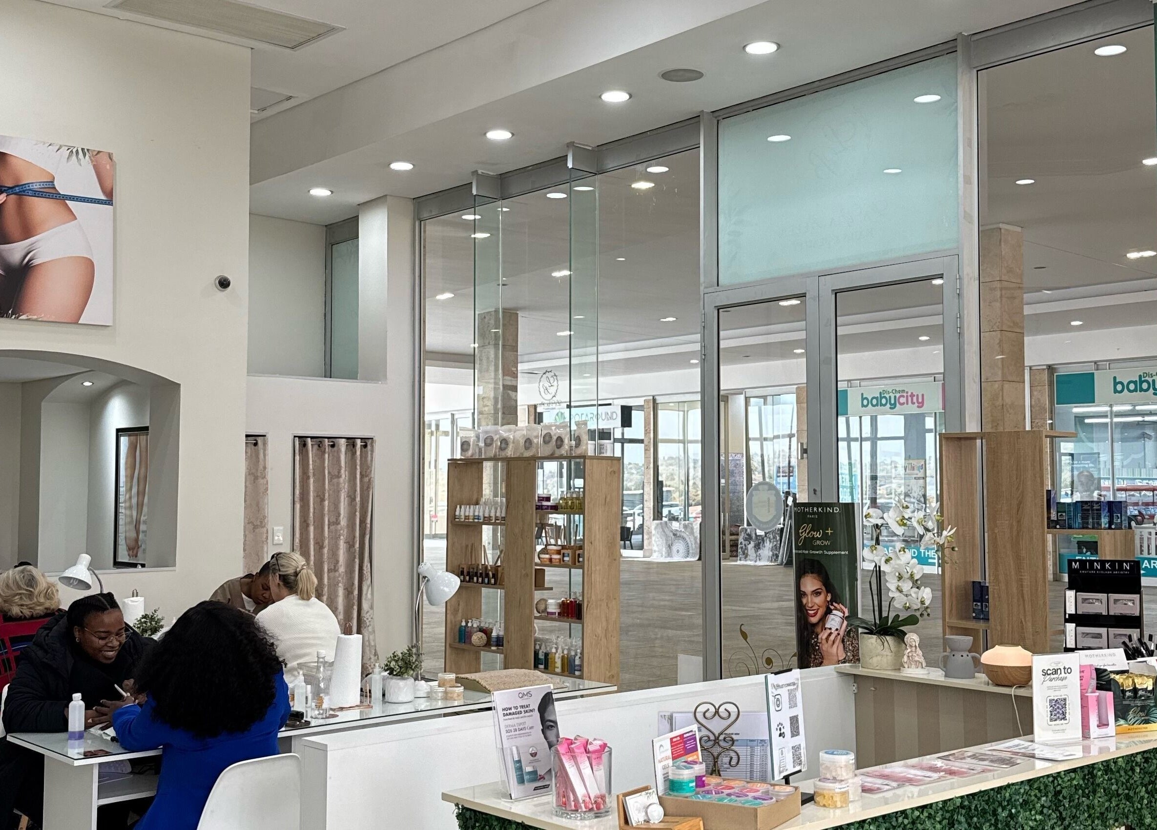 Modern interior of La Via Bella Nails & Beauty in Johannesburg, Gauteng, ZA showcasing nail stations and products.