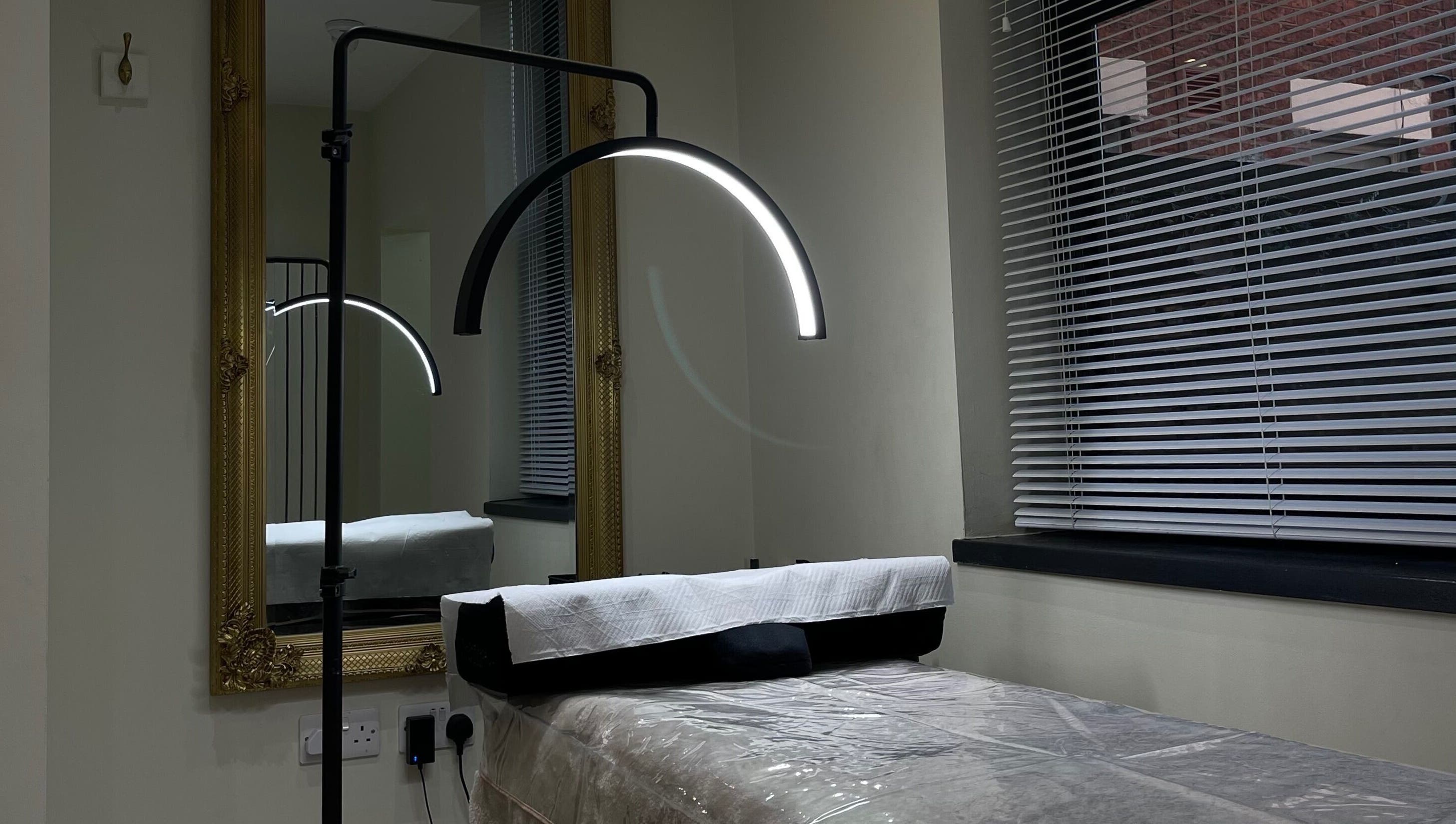 Cozy treatment room at By Brandon Hartley in Preston, England, GB featuring elegant decor and modern lighting.