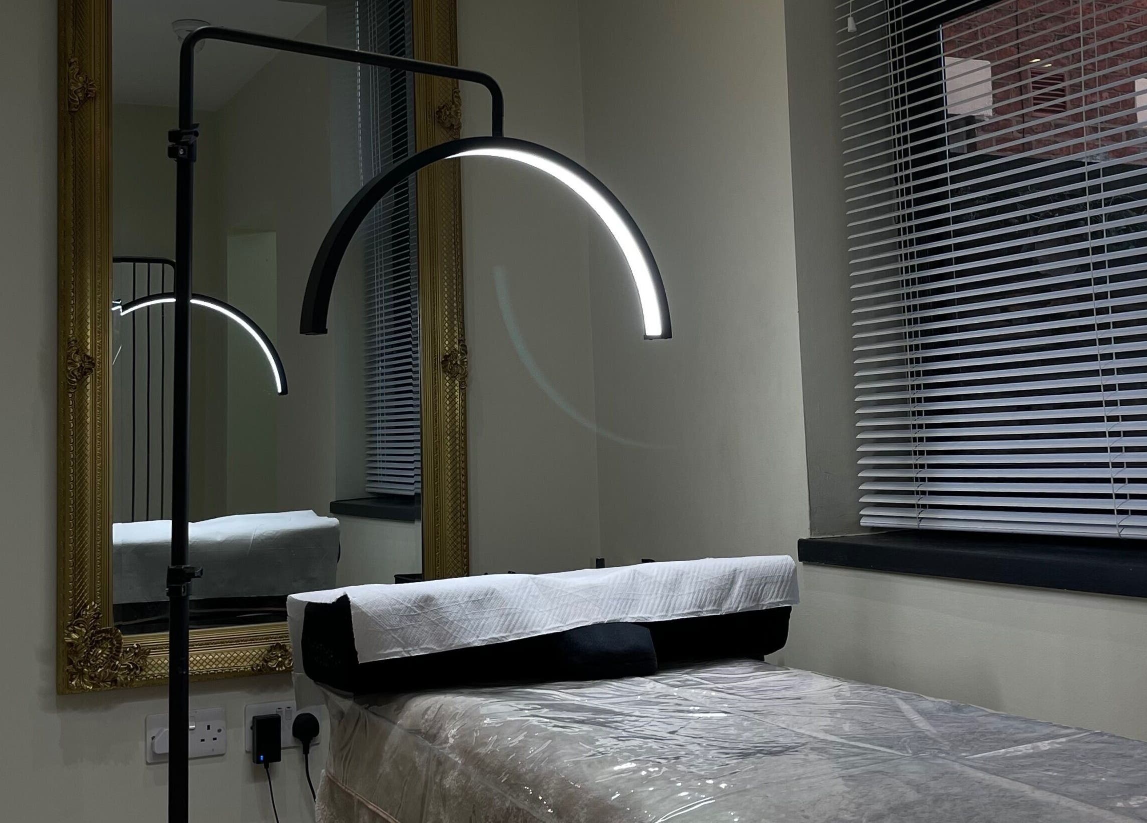 Cozy treatment room at By Brandon Hartley in Preston, England, GB featuring elegant decor and modern lighting.