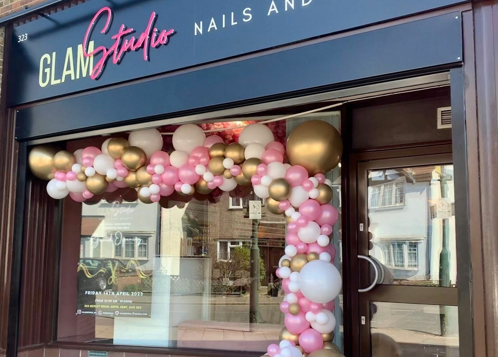 Glam Studio front adorned with pink and gold balloons in Erith, England, GB.