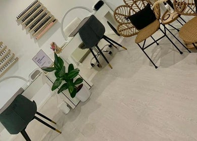 Elegant nail salon at Phoenix Beauty in Maidstone, England, GB, featuring stylish chairs and nail polish displays.
