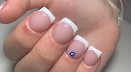 Close-up of elegant French manicure with blue accent by Phoenix Beauty, Maidstone, England, GB.