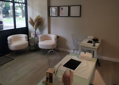 Elegant waiting area with cozy chairs at Vanity, Leicester, England, GB, offering a calming ambiance.